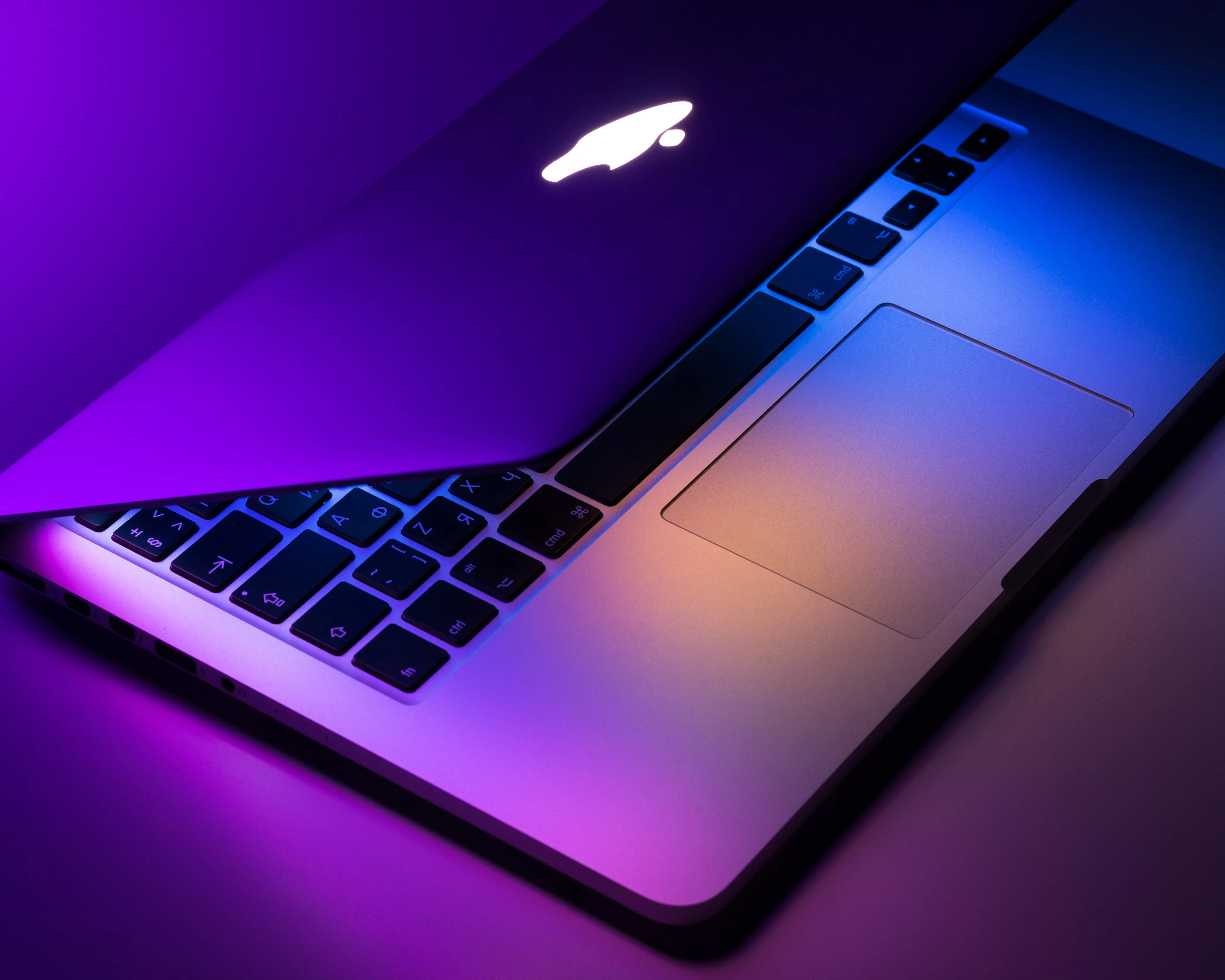 Macbook Neonbook - Photo By Dmitry Chernyshov (https://unsplash.com/@oneor0)